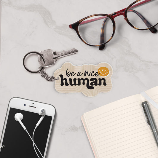 BE A NICE HUMAN KEYCHAIN